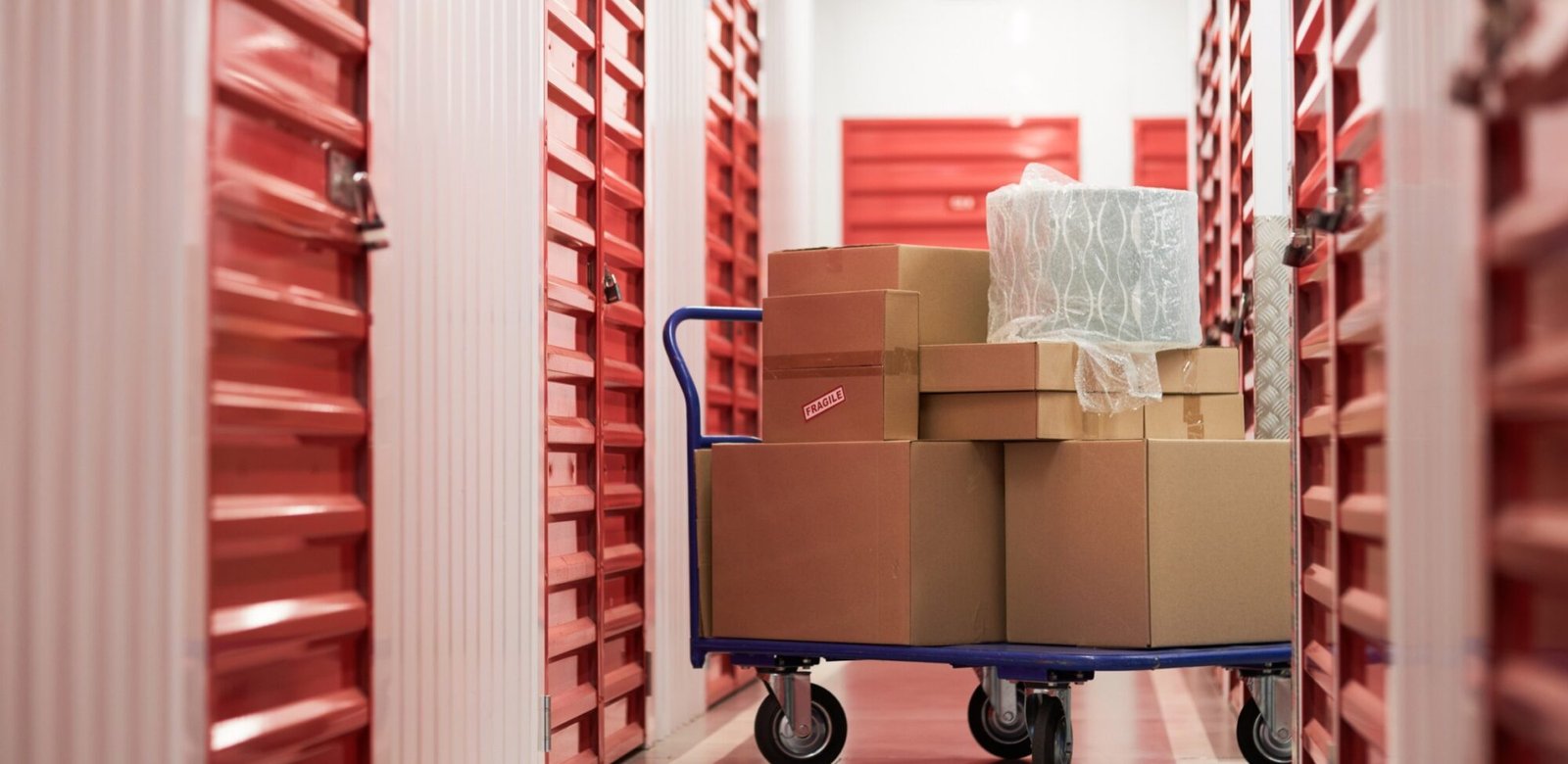 cart with cardboard boxes in warehouse 3phj7p7